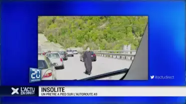 Un prêtre à pied sur l&#039;autoroute A9