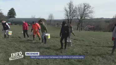 Des réfugiés pour ramasser les débris à Vuisternens-en-Ogoz